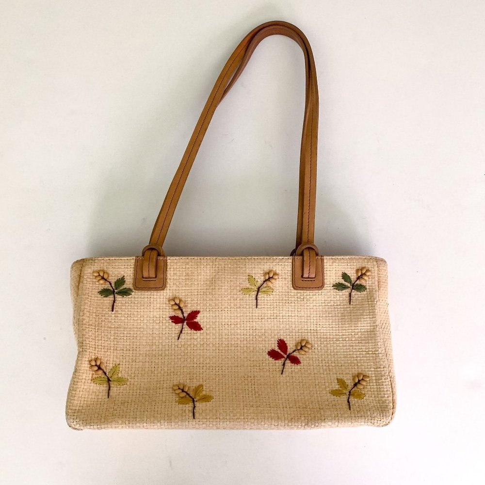 Fossil tan wicker shoulder bag with embroidered and beaded flower design